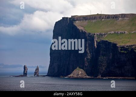 Landscape overlooking the northeast coast of Eysturoy in the North Atlantic with the stone columns Risin og Kellingin, Streymoy, Faroe Islands Stock Photo