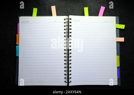 top view of open notepad on black background  Stock Photo