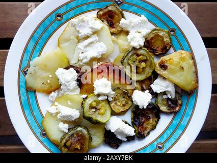 Greek Cuisine. Baked Courgettes with Potatoes and Mizithra Cheese Stock Photo