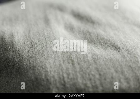 Light Grey woven cotton fabric textile texture close up macro detailed with dramatic lighting Stock Photo