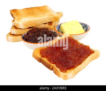 Orange fruit marmalade spread on toast isolated on a white background Stock Photo