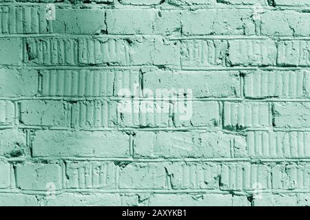 Painted brick wall close up. Abstract background green color toned Stock Photo
