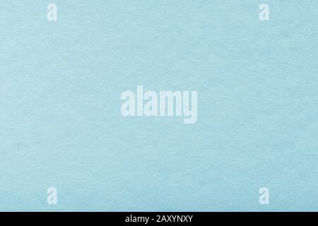 blank old blue paper texture background. Structure of dense turquoise cardboard, large detailed macro closeup. Stock Photo