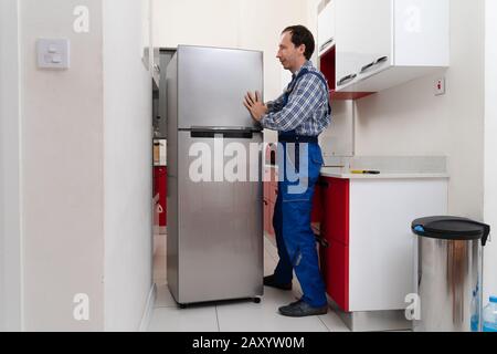 Delivery Install Refrigerator Appliance Mover Carrying Fridge Stock Photo  by ©AndreyPopov 663312874