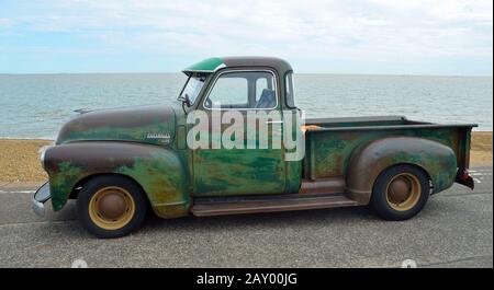 FELIXSTOWE, SUFFOLK, ENGLAND - AUGUST 29, 2015: Classic  Chevrolet 3100 pickup truck with some rust on Felixstowe seafront. Stock Photo