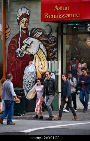 Mural painting and passers-by in Chinatown, San Francisco, California, USA Stock Photo