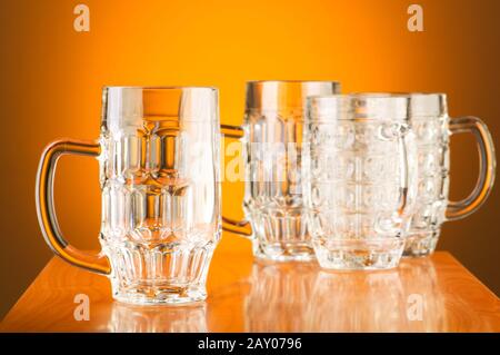 Beer glass against gradient background Stock Photo