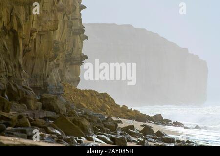 West Bay, Dorset, UK.  14th February 2020.  UK Weather.  View of a rock fall at East Cliff at West Bay in Dorset which happened overnight blocking the beach below.  Recent storms have weakened the famous cliffs making them dangerous to walk beneath.  Picture Credit: Graham Hunt/Alamy Live News Stock Photo