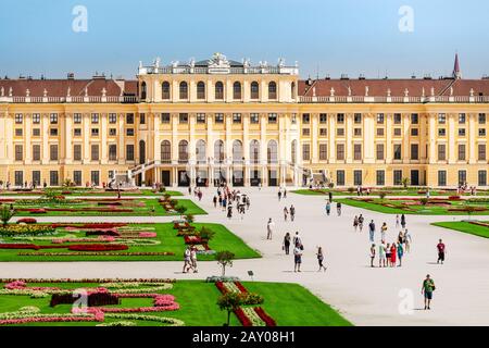 19 July 2019, Vienna, Austria: Tourists visiting famous Schonbrunn Palace, aerial view Stock Photo