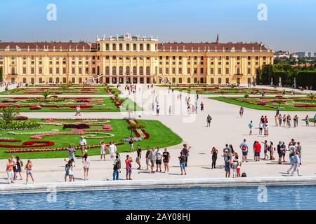 19 July 2019, Vienna, Austria: Tourists visiting famous Schonbrunn Palace, aerial view Stock Photo