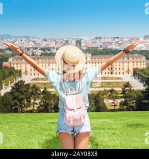 20 July 2019, Vienna, Austria: Happy young woman travelling in Schoenbrunn royal palace garden Stock Photo