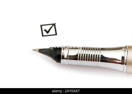 Pen and ticked tick box isolated on white Stock Photo