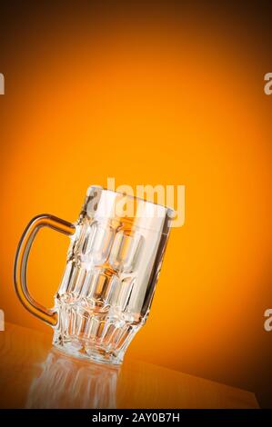 Beer glass against gradient background Stock Photo