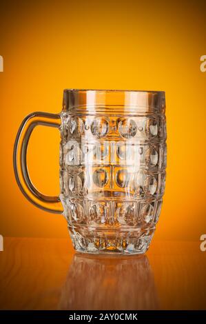 Beer glass against gradient background Stock Photo