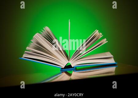 Stack of books against gradient background Stock Photo