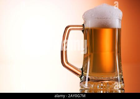 Beer glasses against the colorful gradient background Stock Photo