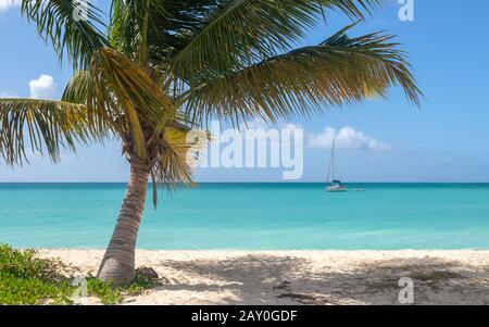 Boat anchored on Ffryes beach, Antigua & Barbuda Stock Photo