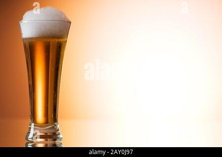 Beer glasses against the colorful gradient background Stock Photo