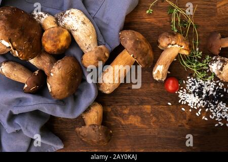 Rice, wild mushrooms and thyme ingredients for a risotto Stock Photo