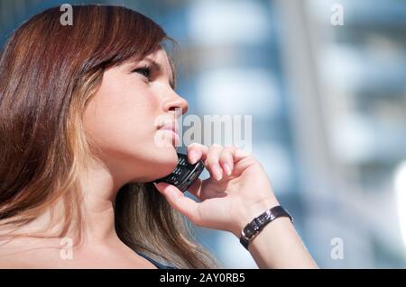 Young business woman using cell phone Stock Photo