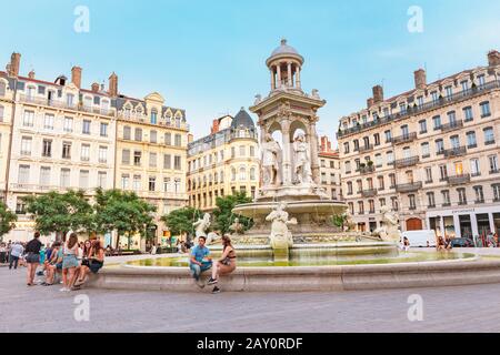 24 July 2019, Lyon, France: Fountain at Jacobin square with relaxing people and tourists Stock Photo