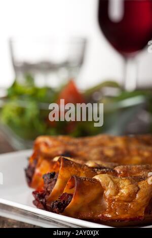 stuffed cannelloni with red wine Stock Photo