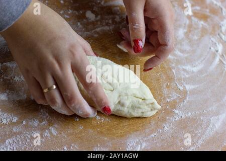 The process of making buns with tea. Raw dough for baking in the oven. Stock Photo