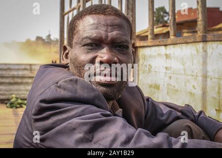 Kampala, Uganda - February 3, 2015: Portrait of a middle-aged black man. Worker truck in a dirty jacket. Stock Photo