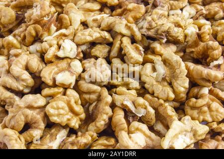 Background texture of walnut kernels. Nut butterflies. Stock Photo