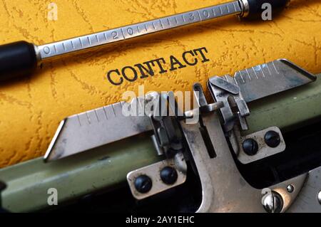 Contact on typewriter Stock Photo