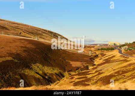 Near Tomintoul in Grampian the Lecht Ski centre in January 2020 deserted due to a total absence of snow. Stock Photo