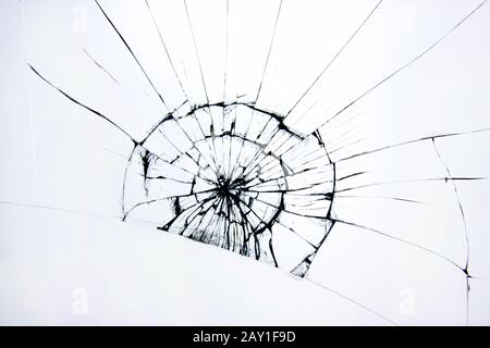 Broken glass cracked window. Cracks on protective glass on white background. Stock Photo