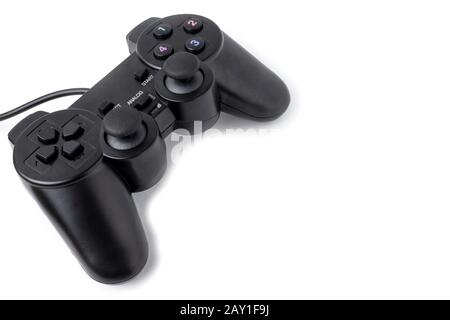Joystick for playing top view isolated on white background with place for text. Black remote control for video games Stock Photo