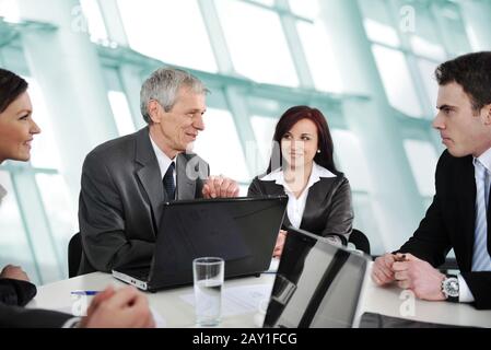 Business meeting - group of people in office at presentation Stock Photo