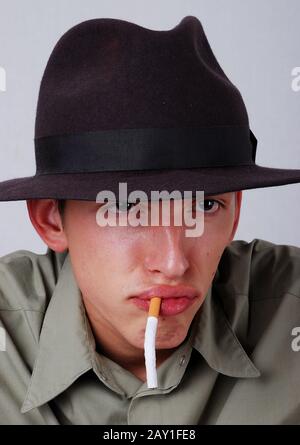 man with cigarette in mouth Stock Photo