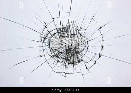 Broken glass with cracks in the window. Stock Photo