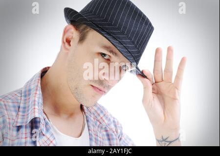 Trendy handsome young man with hat Stock Photo
