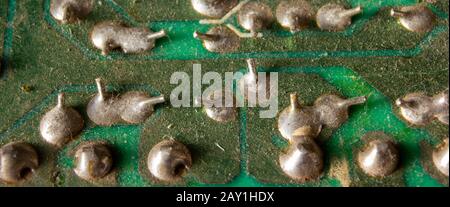 Old and dusty soldering diagram on a detail to the computer. Stock Photo