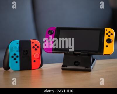 UK - Feb 2020: Nintendo Switch portable games console and joy con controllers in home Stock Photo
