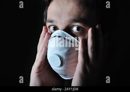 Young man with a mask on his face Stock Photo