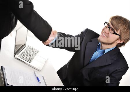 Young handsome businessman shaking hands Stock Photo