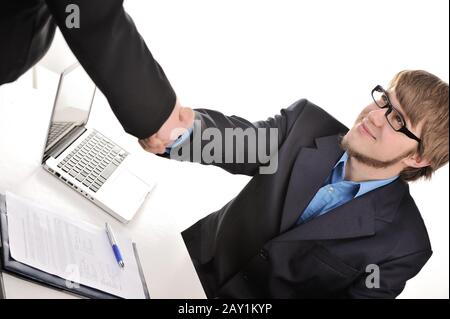 Handsome businessman shaking hands Stock Photo