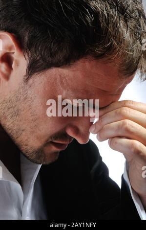 Young man having headache Stock Photo