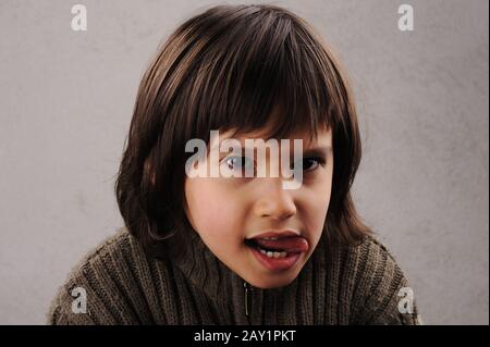 Schoolboy, series of clever kid 6-7 years old with facial expressions Stock Photo