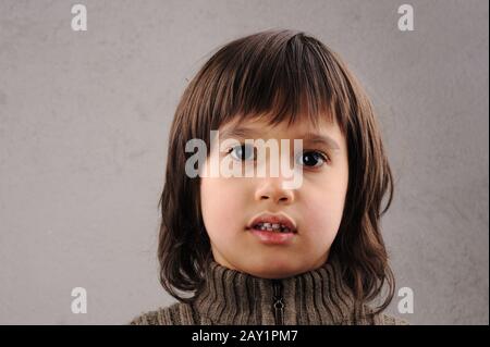 Schoolboy, series of clever kid 6-7 years old with facial expressions Stock Photo