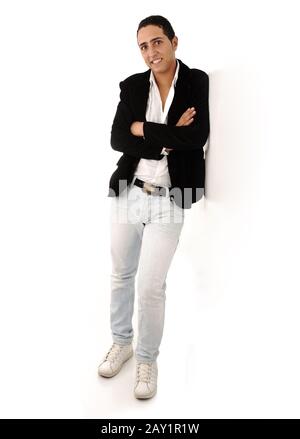 Arabic guy standing against the wall isolated Stock Photo
