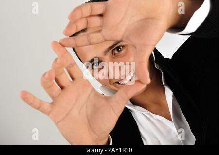 Young man making shape with his hands Stock Photo