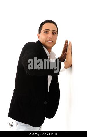 Arabic student leaning against the wall isolated Stock Photo