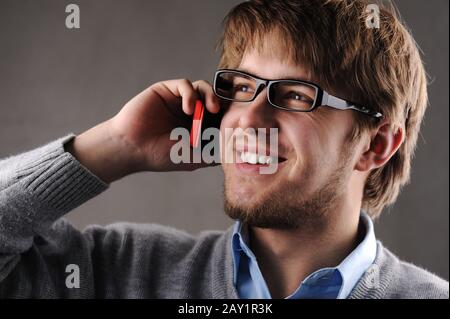 Young attractive man talking on cell phone Stock Photo