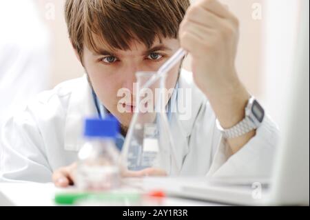 Young medical scientist working in modern lab Stock Photo